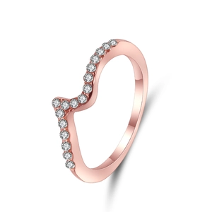 Detailed close-up of a V-shaped wavy rose gold ring with sparkling white cubic zirconia stones