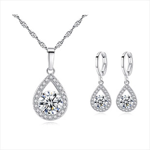 Detail view of pear-shaped pendant and earrings set with brilliant round cubic zirconia