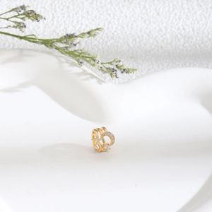 U-shaped non-piercing gold nose cuff with three layers and star zircon accents