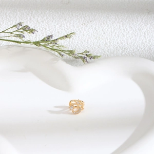 Gold multi-layer non-piercing ear cuff featuring cubic zirconia star and moon designs