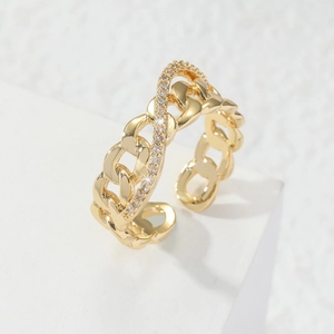 Macro shot of gold-plated chain ring with micro-pave cubic zirconia and adjustable opening