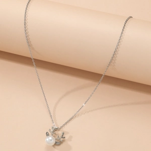 Elegant reindeer antler pendant necklace with a white pearl and silver link chain