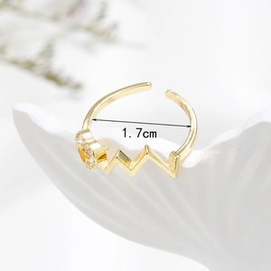 Minimalist gold heart wave open ring with zircon inlay on an elegant white tray