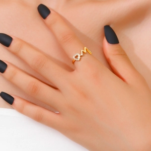 Adjustable gold heart ring with pavé crystals and letter M on a female model finger