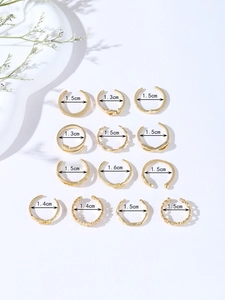 Detailed view of 13-piece gold ring set showing various sizes from 1.3cm to 1.6cm