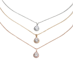 Ensemble de trois colliers goutte d'eau en argent, or et or rose avec pavé de cristaux