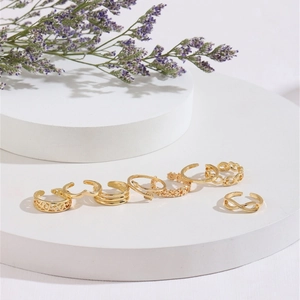 8-piece gold adjustable toe ring set with arrow and infinity designs for beach wear