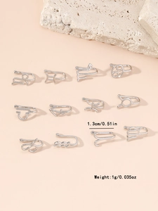 Detailed view of 12 silver zodiac non-pierced nose clips with 1.3cm size and 1g weight
