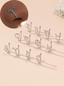 Detail view of 12 constellation non-pierced U-shaped nose clips in silver finish
