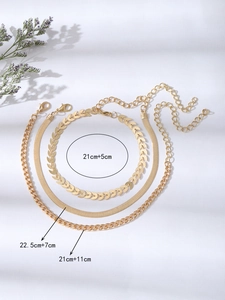 Ensemble de trois bracelets de cheville dorés avec chaînes blé, serpent et gourmette