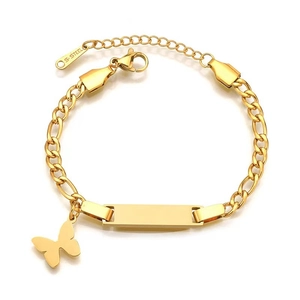 Detail of gold Figaro chain bracelet with blank engravable plate and butterfly charm
