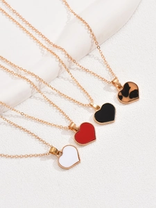 Detail of colorful heart necklaces with gold chains and leopard print enamel pendants
