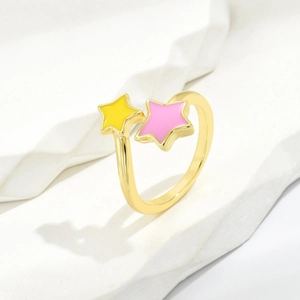 Fashionable gold plated adjustable ring featuring yellow and pink enamel star charms