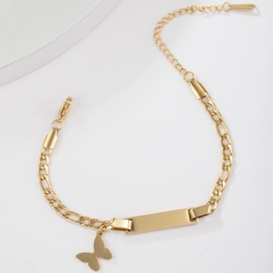Golden stainless steel bracelet with butterfly charm and engravable ID plate on white background