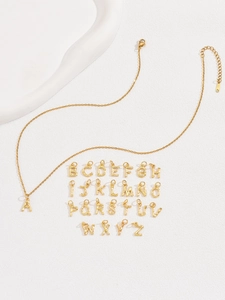 Detailed view of 26 bamboo-textured gold letter pendants on a stainless steel chain
