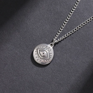 Minimalist stainless steel evil eye sunburst pendant necklace with a round coin charm