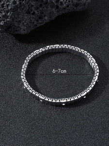 Detail view of silver stretch bracelet with clear cubic zirconia insets and size label