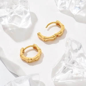Fashionable gold-plated bamboo joint hoop earrings with a premium geometric clasp design