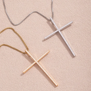 Elegant gold and silver cross necklaces with micro-pave cubic zirconia on box chains