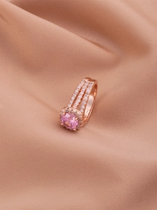 Detailed macro view of the rose gold triple-layer ring with sparkling pink cubic zirconia