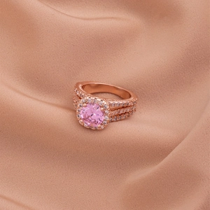 Luxury rose gold ring with a round pink halo zircon and triple-row pave diamonds