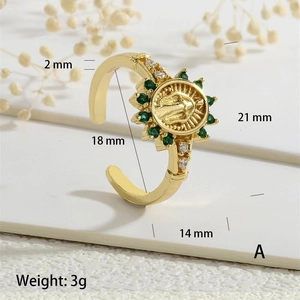 Close-up of gold medallion ring with green cubic zirconia and size dimensions info