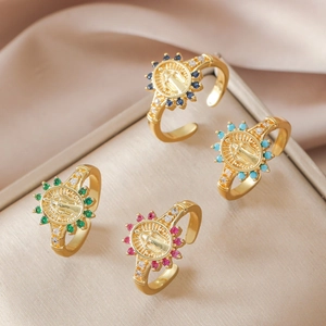 Gold adjustable rings with colorful zircon and Virgin Mary engraving on velvet stand