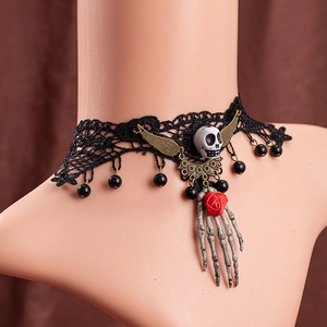 Gothic black lace choker featuring a red rose flower and white skull with gold wings charm