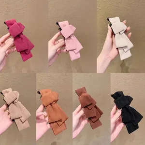 Elegant suede bow banana hair clips in seven colors for secure ponytail styling