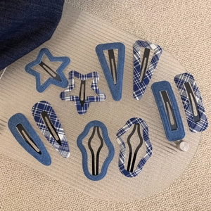 Retro navy blue denim and plaid BB hair clips set arranged on a wooden tray