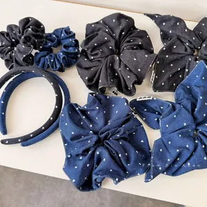 Detail showing vintage denim scrunchies and headbands with white heart polka dot pattern