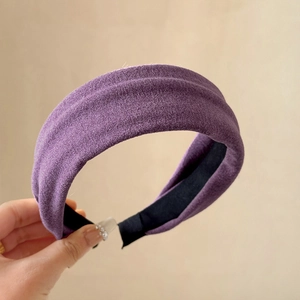 Detail showing plush purple headband texture with non-slip black fabric lining
