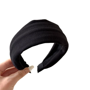 Classic black puffy headband in velvet fabric for elegant hair styling and volume