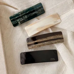 Set of four handmade French vintage acetate hair clips in marble and wave patterns