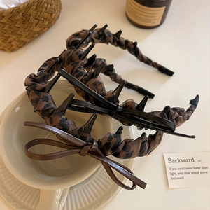 Serre-tête vintage à motif léopard avec nœud et dents pour un maintien sûr