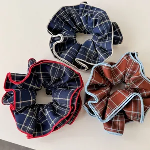 Three-pack vintage British plaid hair scrunchies with elegant ruffled fabric design