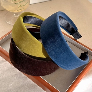Three elegant velvet padded headbands in yellow, brown and blue colors for women