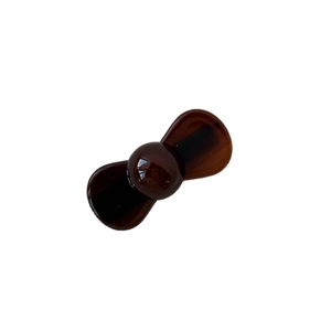 Glossy dark brown translucent mini hair clip in a minimalist resin bow style