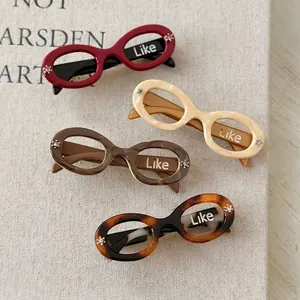Sunglasses shaped acetate hair clips with small rhinestones in four elegant colors