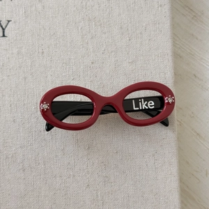 Chic sunglasses-shaped acetate hair clip in red and black with Like text and rhinestones
