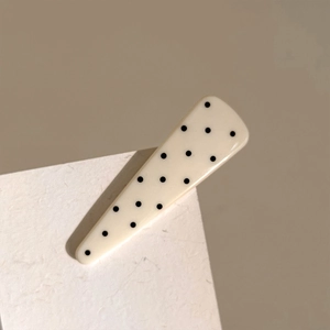 Polka dot triangular hair clip in creamy white with black patterns for women