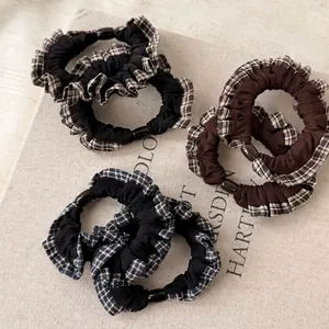Three-piece vintage plaid lace hair scrunchies set in black, brown, and navy blue