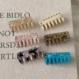 Colorful retro acetate hair clips with rhinestones in marble and tortoiseshell patterns
