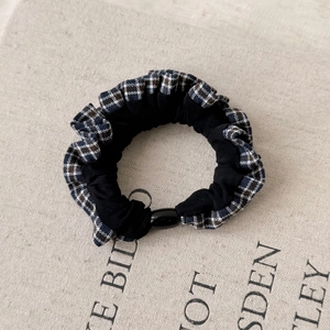 Vintage black and white plaid lace scrunchie for hair tie accessories on beige background