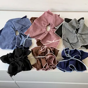 Double-layered plaid bow hair scrunchies in six assorted colors on a clean white surface