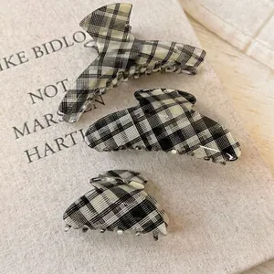 Three pieces set of black and white plaid acetate hair claws in various sizes for women