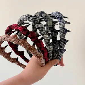 Set of four plaid fabric headbands with non-slip teeth in red, brown, and blue colors