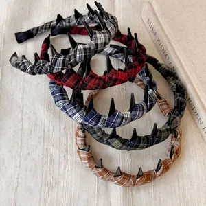 Detail of plaid fabric headbands with non-slip teeth in various classic colors