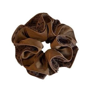 Elegant brown leopard print scrunchie with silky satin texture for stylish hair styling