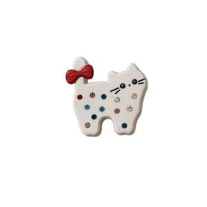 Sweet cat shaped acetate hair clip with sparkling rhinestones and a red bow detail